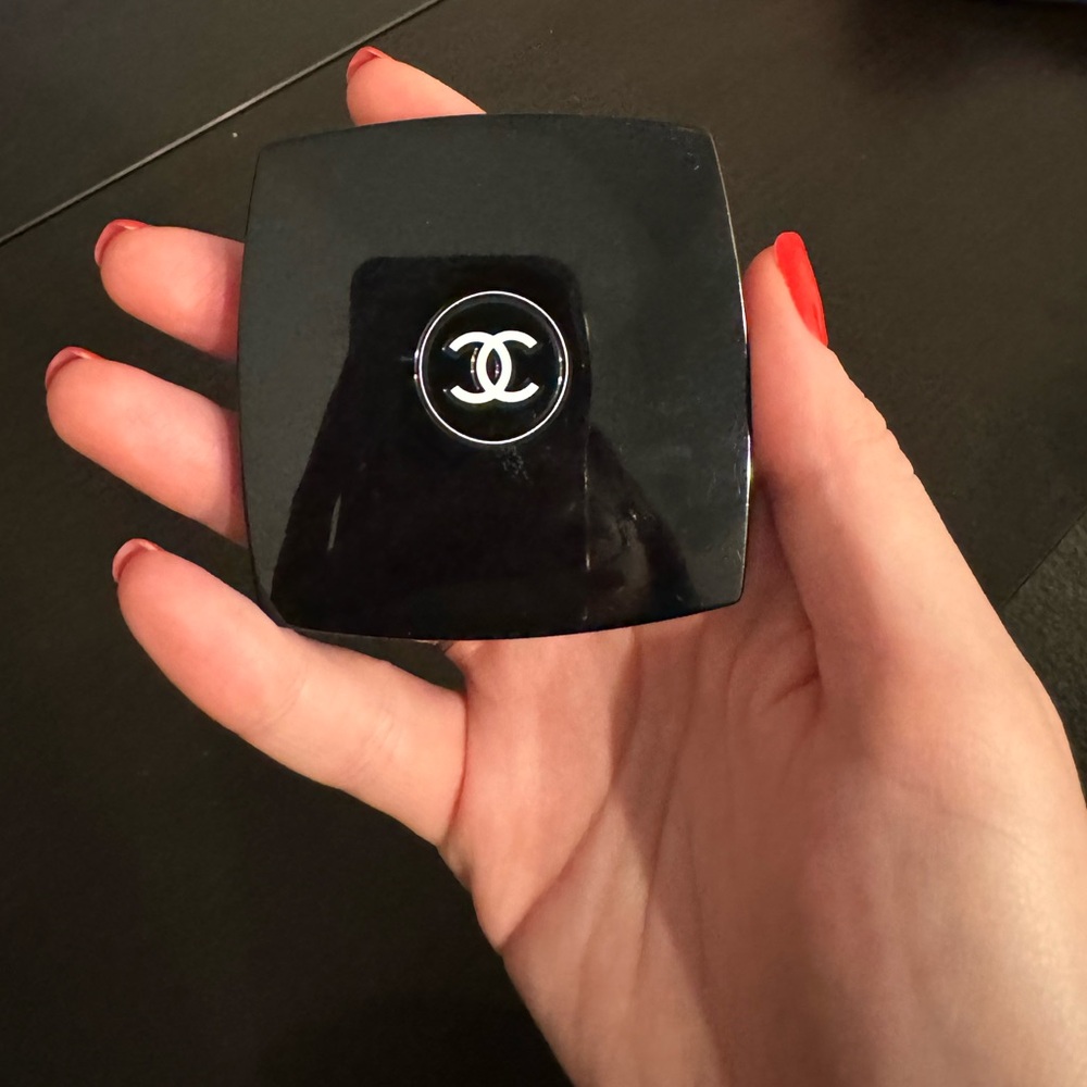 Chanel black makeup compact.
